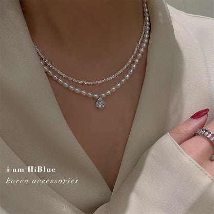 Korean version of the red new freshwater pearl necklace retro multi-layer temperament clavicle chain plated platinum zircon pendant cross-border